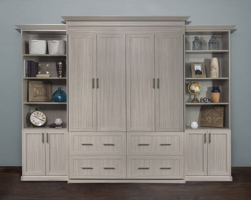 Murphy bed wall unit closed, with paneled cabinet doors in the center and bookcases with lower cabinets on each side