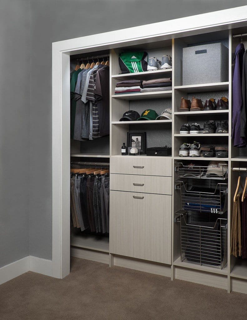 Light wood-grain reach-in closet with drawers, a door cabinet, shoe shelves and pull-out wire baskets