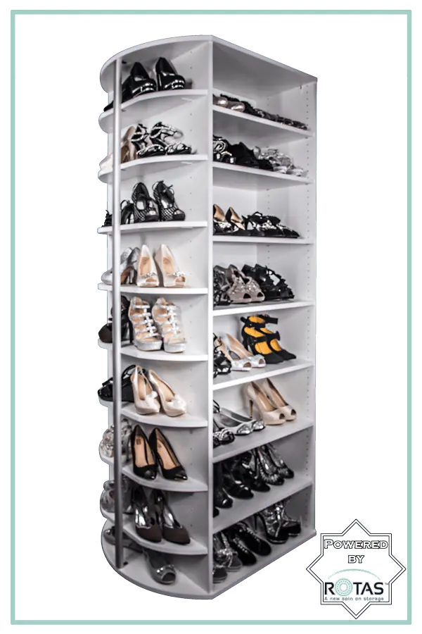 A shoe rack filled with lots of shoes on a white background.