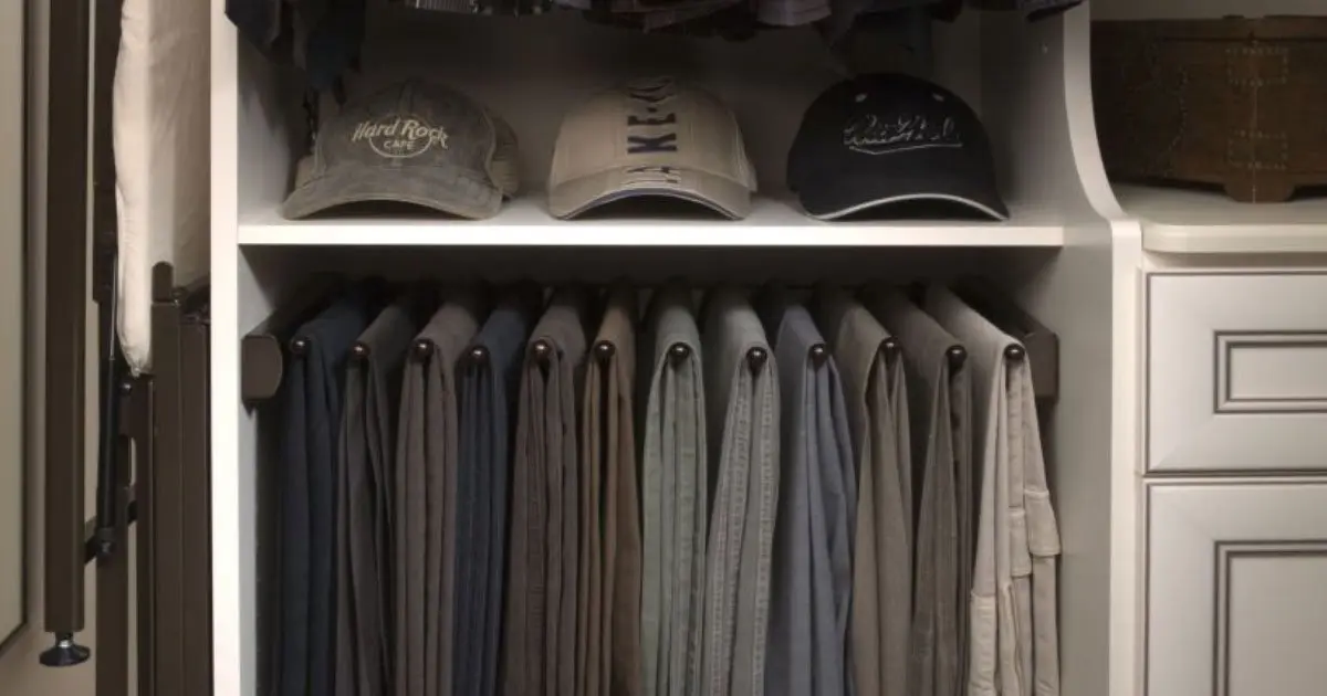 A closet filled with hats and pants.