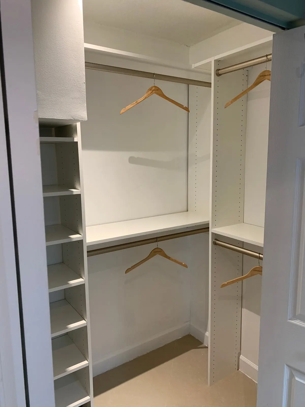 Custom Closet System with Shaker Draw Fronts and Bronze Hardware