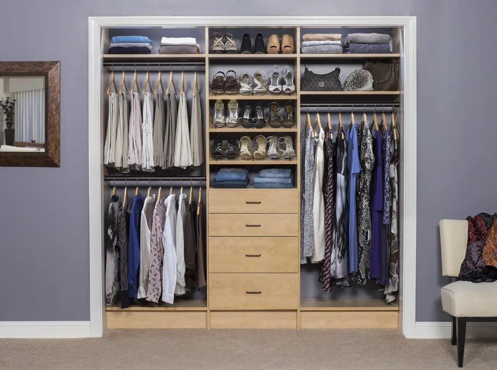 A closet filled with lots of clothes and shoes